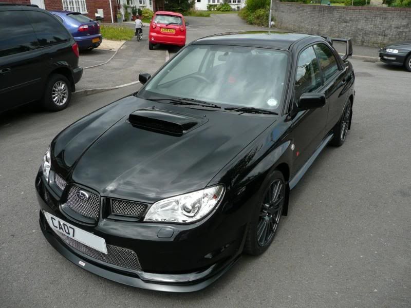 This magnificent Impreza RB320 in it's glorious Obsidian Black finish came